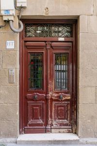 a large wooden door on a building at Habitaciones en la Plaza Nueva in Bilbao