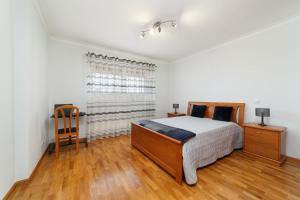 Cama ou camas em um quarto em Casa do Monte Amarelo mais 14 fotos