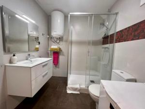 a bathroom with a shower and a sink and a toilet at Bcn Friendly Parlament in Barcelona