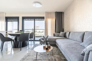 a living room with a couch and a table at jerusalem luxury apartment in Jerusalem