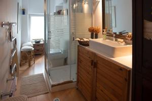 a bathroom with a shower and a sink and a mirror at Architect Art Studio in Athens +24 photos