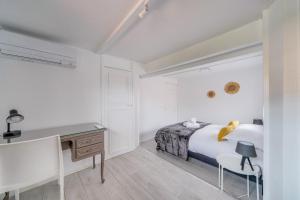 Łóżko lub łóżka w pokoju w obiekcie La Casa Bohème - Superbe maison avec parking privé