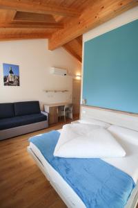 Postel nebo postele na pokoji v ubytování Agriturismo Antico Fenilon