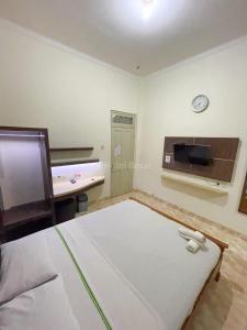 Letto o letti in una camera di Hotel Besar Purwokerto