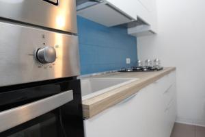 Kuchyň nebo kuchyňský kout v ubytování Residence Verdena appartamento 02