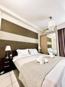 Postel nebo postele na pokoji v ubytování Mc Queen Rooms & Apartments