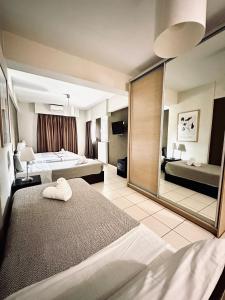 Postel nebo postele na pokoji v ubytování Mc Queen Rooms & Apartments