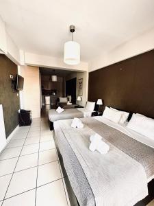 Postel nebo postele na pokoji v ubytování Mc Queen Rooms & Apartments