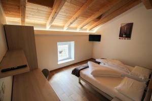 Postel nebo postele na pokoji v ubytování Agriturismo Antico Fenilon