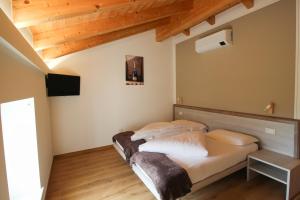 Postel nebo postele na pokoji v ubytování Agriturismo Antico Fenilon
