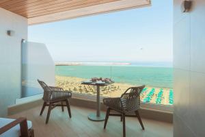 a room with a view of the beach and the ocean at BIO BEACH Boutique Hotel - Adults Only in Rethymno