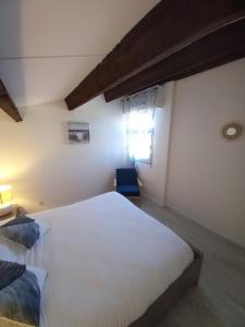 Posteľ alebo postele v izbe v ubytovaní la petite toscane