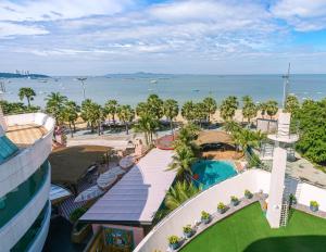 an aerial view of a resort with the ocean at A-One The Royal Cruise Hotel Pattaya - SHA Extra Plus in Pattaya
