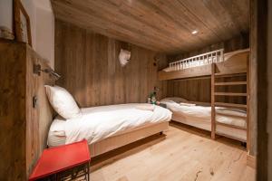 Posteľ alebo postele v izbe v ubytovaní Chalet des Ours I Le Chalet Club