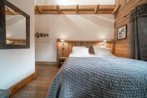 Posteľ alebo postele v izbe v ubytovaní Chalet des Ours I Le Chalet Club