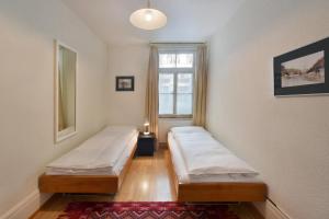 Postel nebo postele na pokoji v ubytování Hotel National Bern