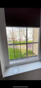 a window with a view of a street at Garsoniera la malul marii in Mangalia