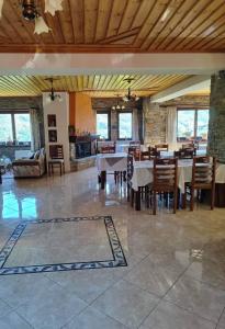 a large dining room with a table and chairs at Evridiki in Zagora