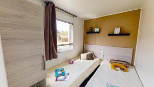 Posteľ alebo postele v izbe v ubytovaní Camping Officiel Siblu Les Oyats