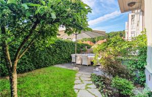 a patio with an umbrella and a table and chairs at Amazing Home In Gteborg With Wifi in Gothenburg