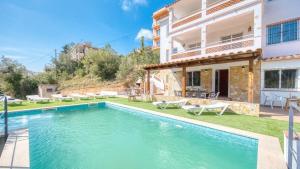 an image of a villa with a swimming pool at Costacabana - Villa Pilar in Lloret de Mar