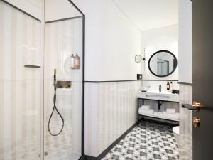 a bathroom with a shower and a sink at Axis Porto Club Aliados in Porto +79 photos