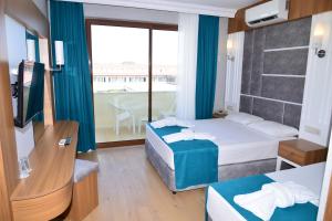 Postel nebo postele na pokoji v ubytování Side Yeşilöz Hotel