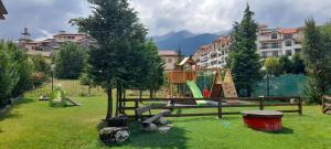 a park with a playground with a slide at Katy's studio in Bansko