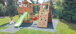 a playground with a slide and a climbing frame at Katy's studio in Bansko