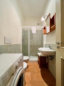 a bathroom with a toilet and a sink and a shower at Villachiara in Silvi Marina +121 photos