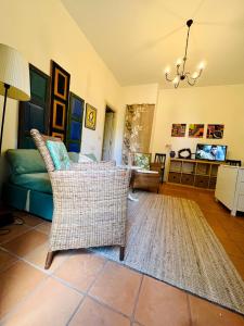 a living room with a couch and wicker chairs at Villachiara in Silvi Marina