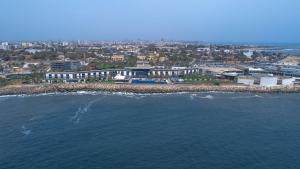 an aerial view of a city and the ocean at Radisson Blu Hotel, Dakar Sea Plaza in Dakar