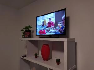 TV a/nebo společenská místnost v ubytování CASA VACANZE I MORI