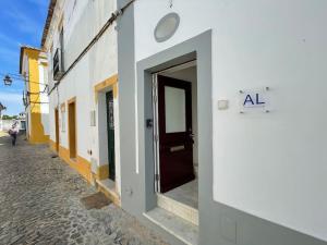 a door on the side of a building at Casa da Oliveira in Évora