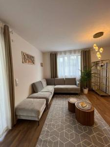 a living room with a couch and a table at Moderne Wohnung mit 4 Betten in Bochum