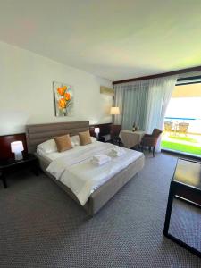 Postel nebo postele na pokoji v ubytování CORPUS A - Hotel Albatros
