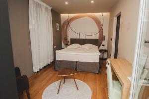 Postel nebo postele na pokoji v ubytování Hotel Nostromo