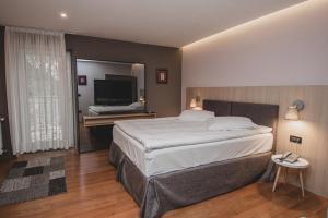 Postel nebo postele na pokoji v ubytování Hotel Nostromo