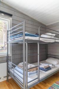 a room with two bunk beds in a room at Torpet - Bed and Breakfast med charm in Norrfjärden