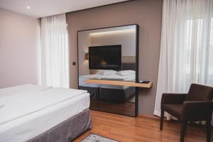 Postel nebo postele na pokoji v ubytování Hotel Nostromo