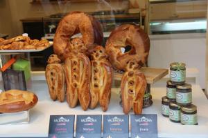 a display of bread and pretzels in a bakery at Secluded & Charming Gîte Surrounded by Nature in Désaignes