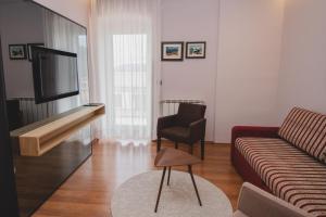 TV a/nebo společenská místnost v ubytování Hotel Nostromo