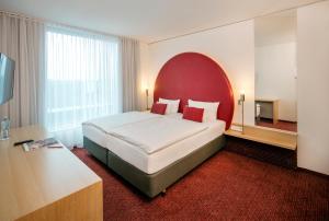 ARCOTEL Rubin Hamburg客房内的一张或多张床位