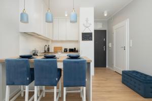 Kuchyňa alebo kuchynka v ubytovaní Apartamenty Morska Fala-Gardenia