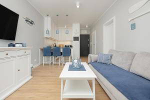 Kuchyňa alebo kuchynka v ubytovaní Apartamenty Morska Fala-Gardenia