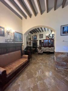a living room with a couch and a table at EL POBLET DE ATALAYAS in Alicante