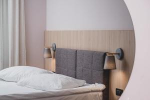Postel nebo postele na pokoji v ubytování Hotel Nostromo