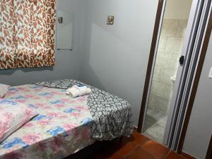 Un pat sau paturi într-o cameră la Pousada do colono