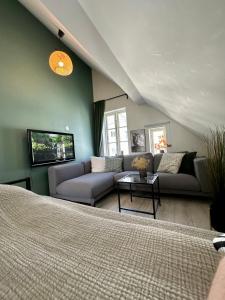 a living room with a couch and a table at A Place To Stay Stavanger, apartment 3 in Stavanger