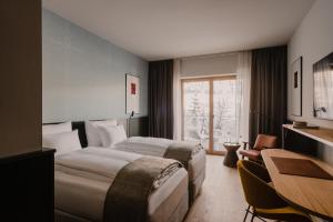 Katil atau katil-katil dalam bilik di The Comodo Bad Gastein, a Member of Design Hotels